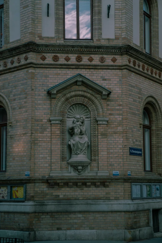 a decorative statue is on the side of a building