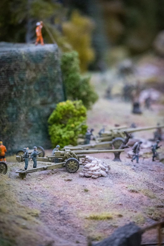 toys are on the ground with miniature soldiers around them