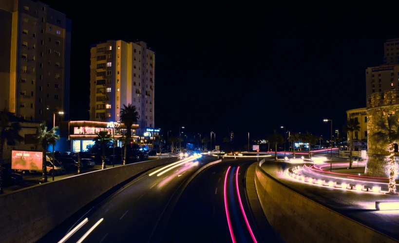 a wide city street that has traffic moving at different times