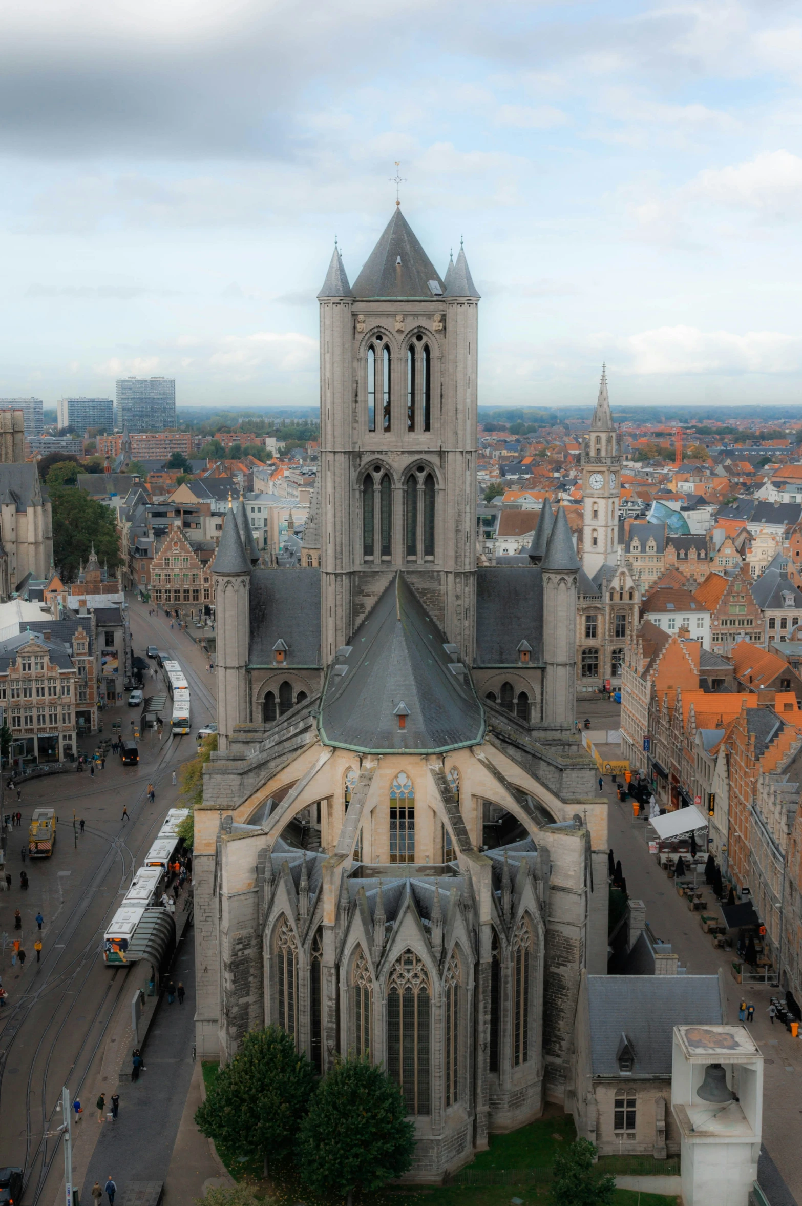 a large cathedral towering over a city filled with tall buildings