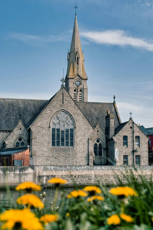 a church that is in front of a body of water