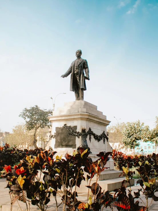 the statue of aham lincoln near the entrance to the american war cemetery