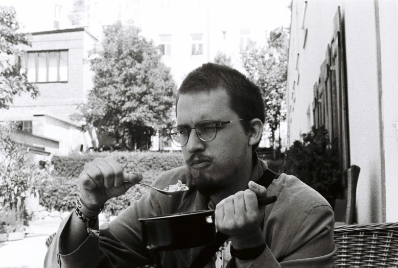 a man is taking a selfie while sitting down