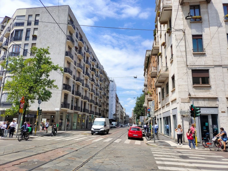 the vehicles in the city are traveling through the intersection