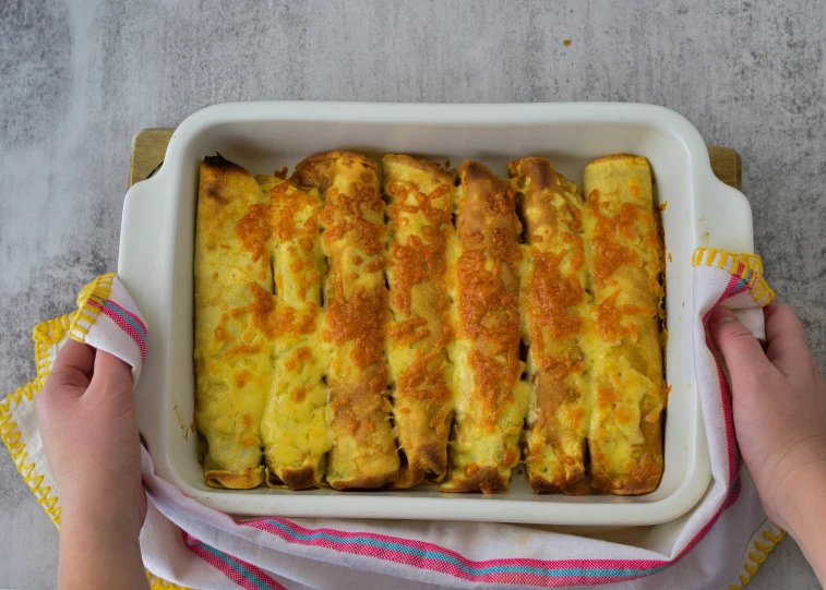 a large baked casserole sitting in a dish on a table