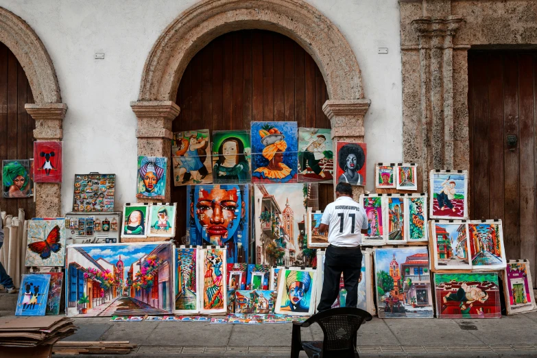 a street vendor stands outside an old style building