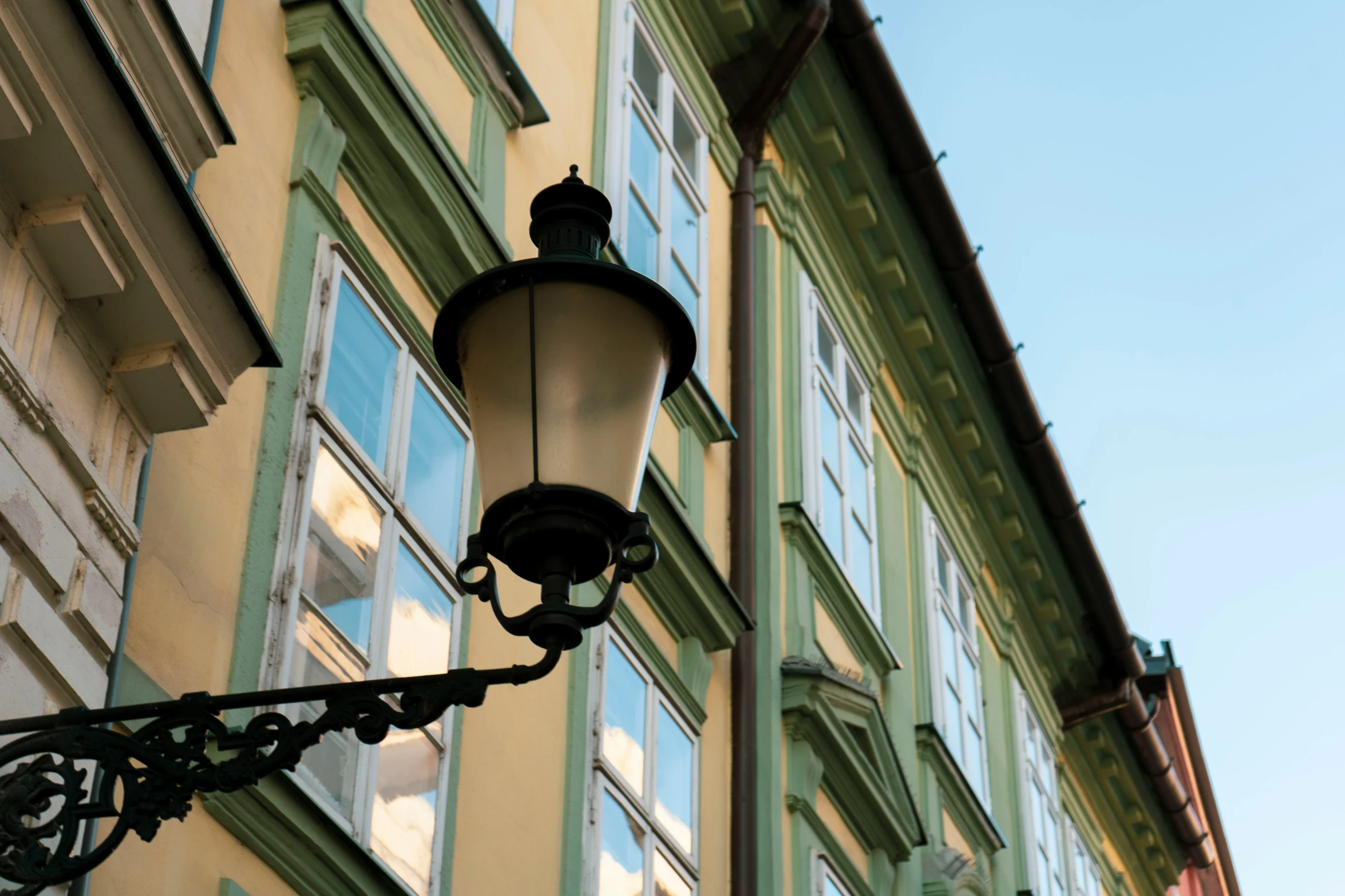 a large light hanging off the side of a building