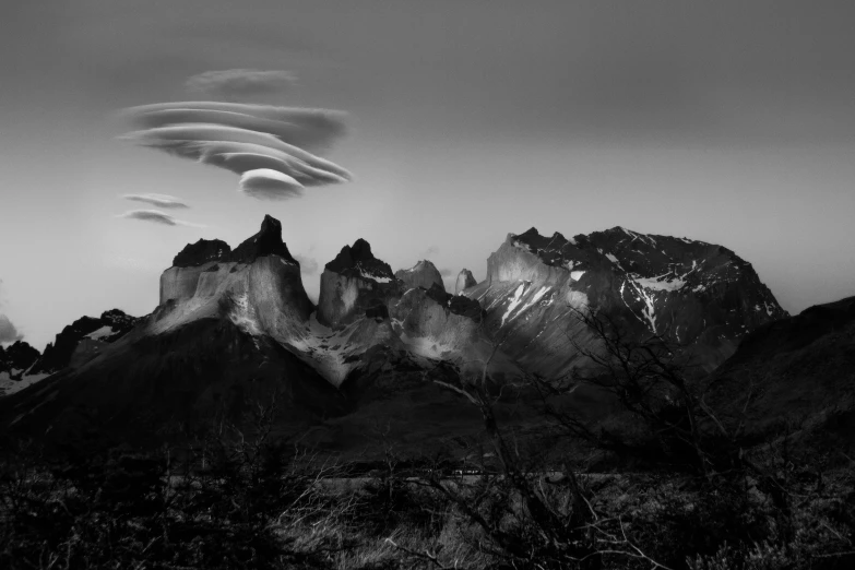 black and white pograph of mountains with cloudy skies