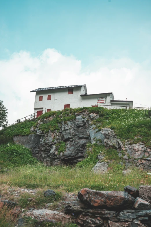 a white house on top of a hill