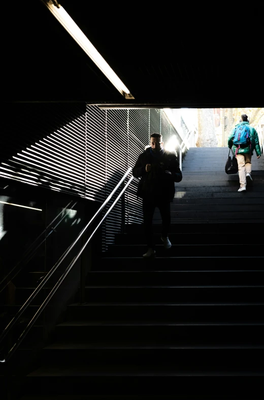 a woman is going up the stairs of some sort