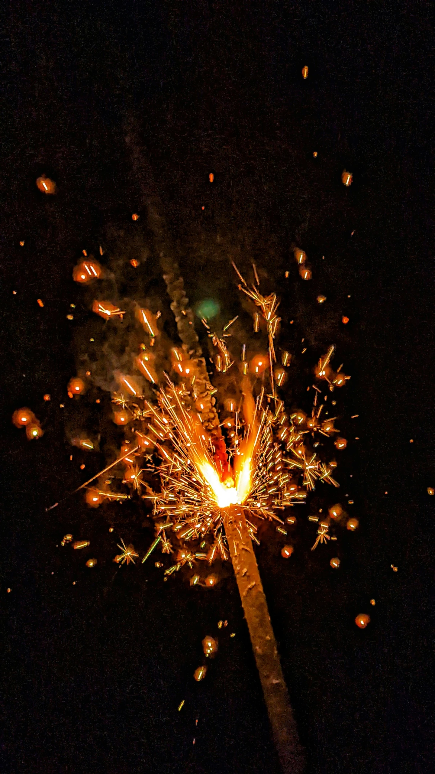 some fireworks lights are on top of a pole