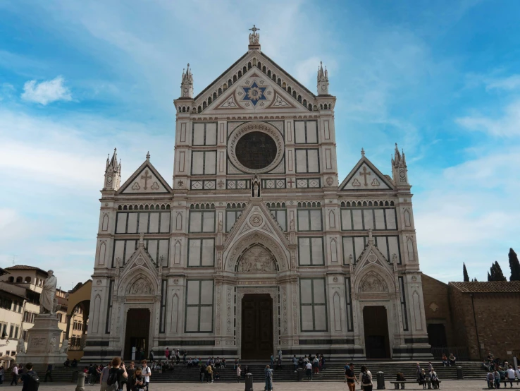 a large church with a sky background in the day