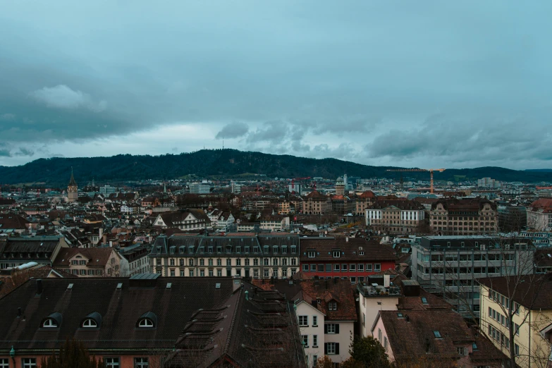 looking down on a very large city under a gray sky