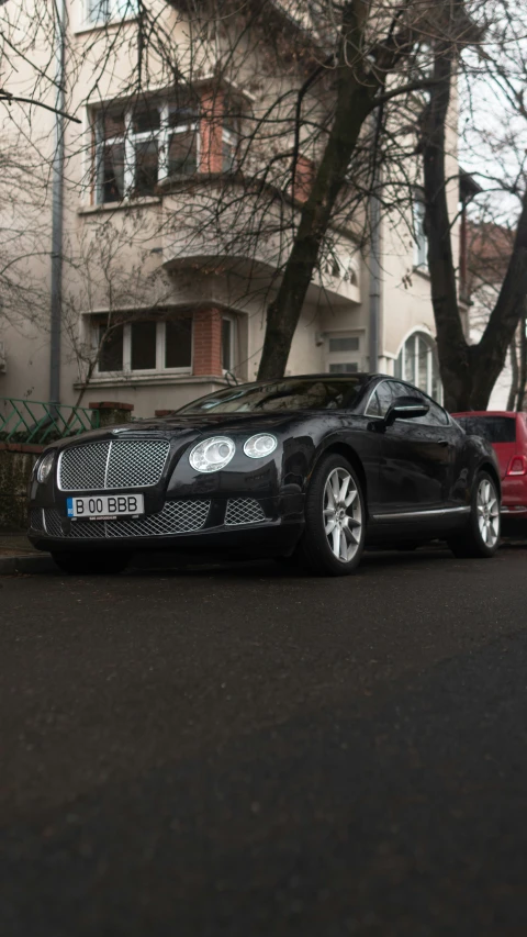 a car on a street with some cars nearby