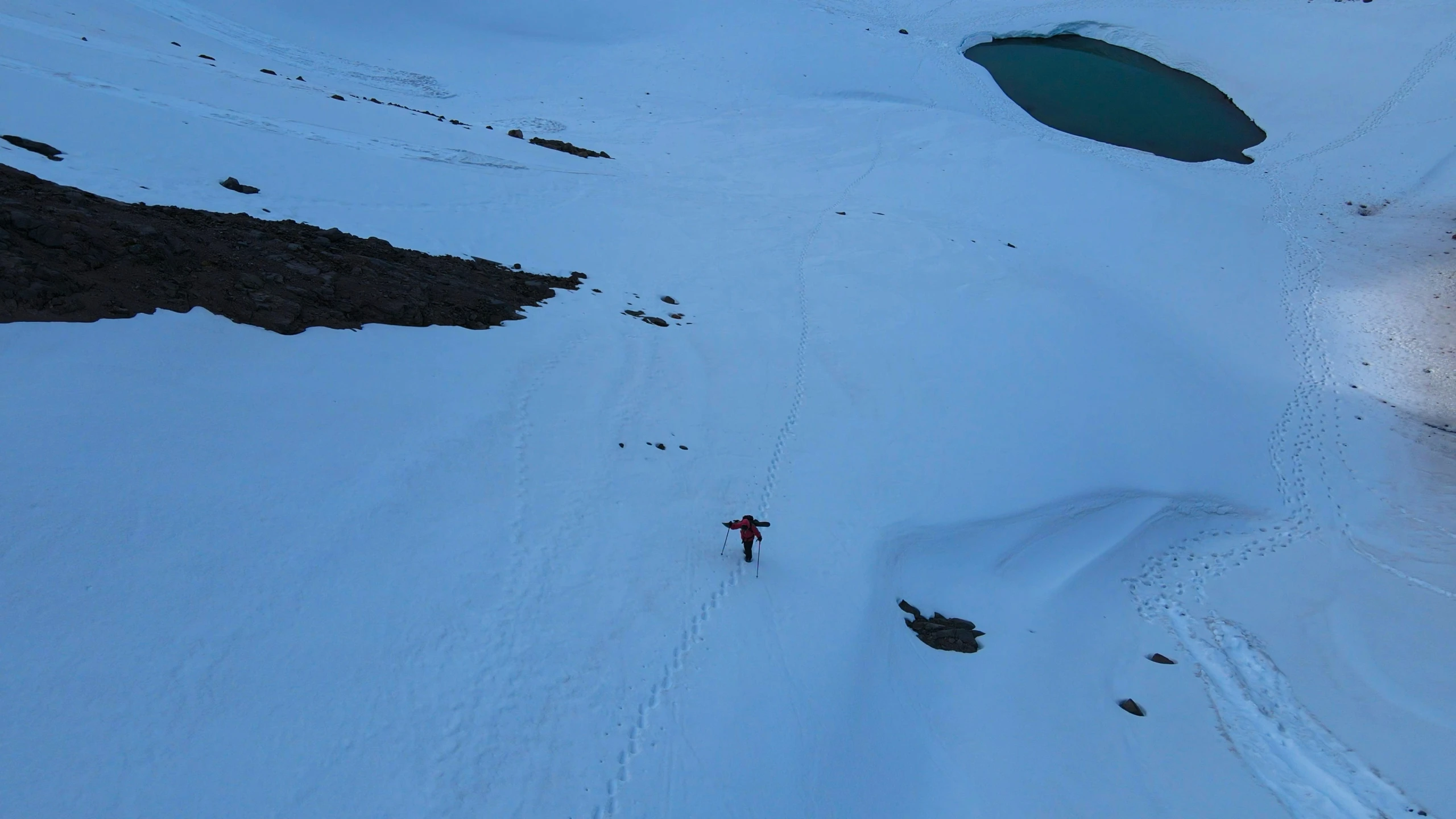 someone skiing down the side of a mountain