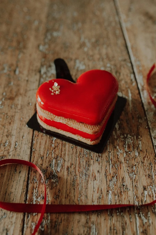 an image of heart shaped biscuits on wood floor