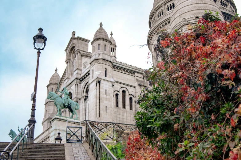 a cathedral with turrets and many flowers