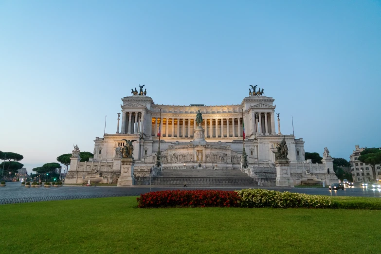 a large monument that looks like it is in the middle of some grass