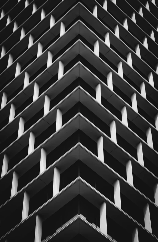 the front of a black building with a dark facade