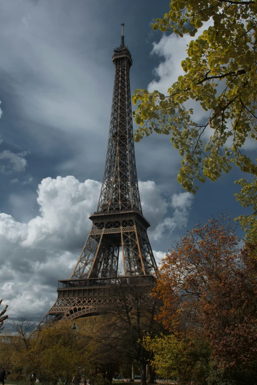 a large building with an ornate structure against a cloudy sky