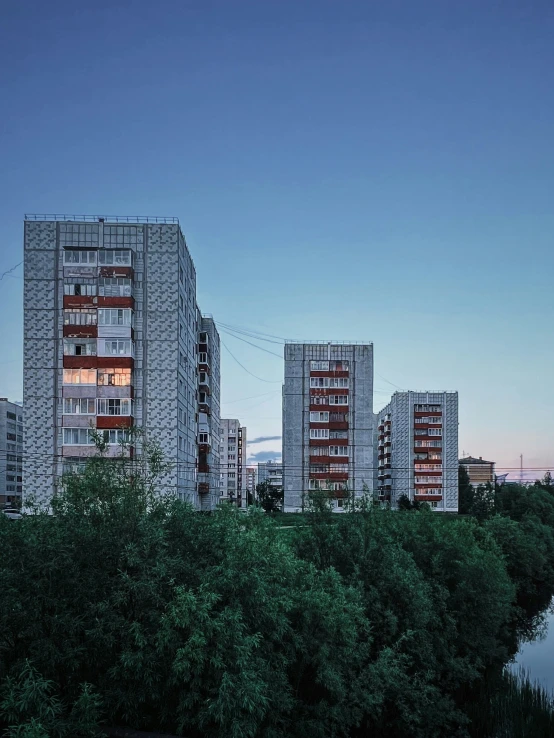 several apartment buildings in the middle of a city area