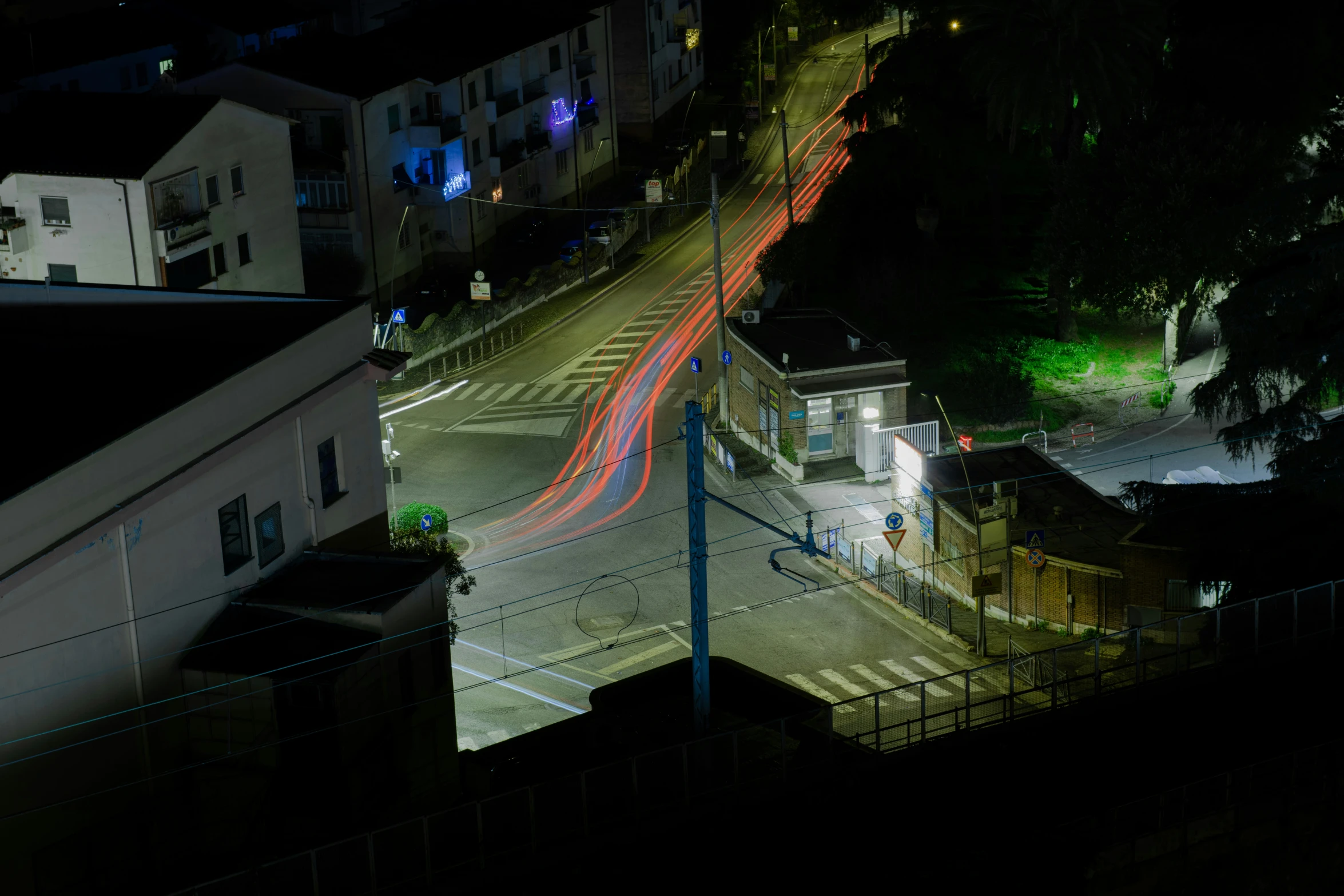 night time po of city street with buildings and traffic