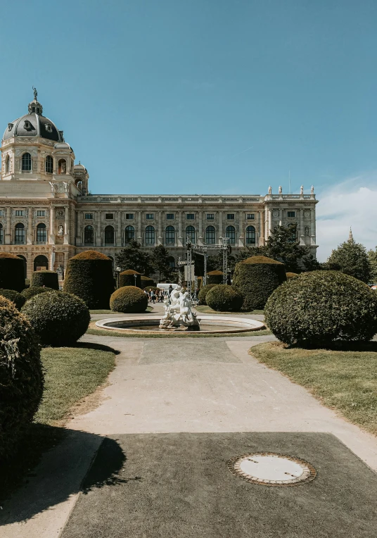 a big building that is sitting in the middle of grass