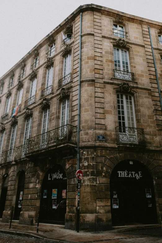 a three story building on an empty street