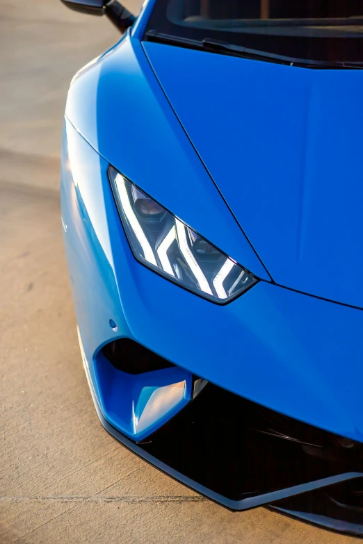 the front view of a blue sports car