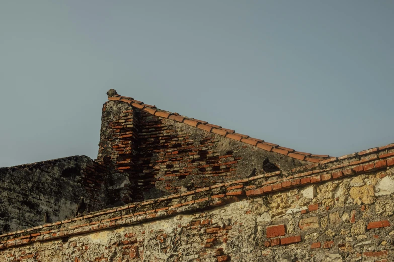 a very old brick structure that has some bricks on it