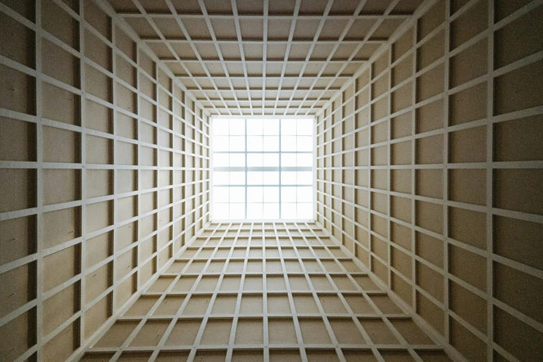 a geometric view of an empty room with a square window in the middle