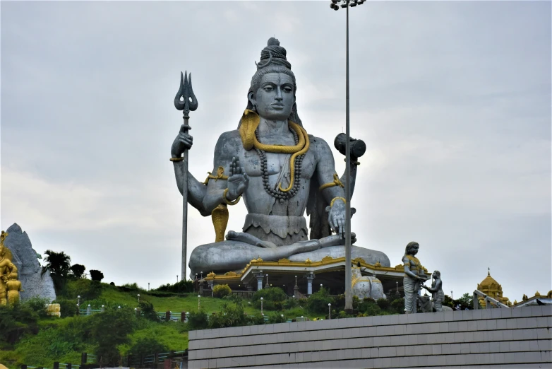 a statue sits on top of a set of steps