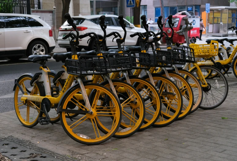 an image of a yellow bicycle parked at a street