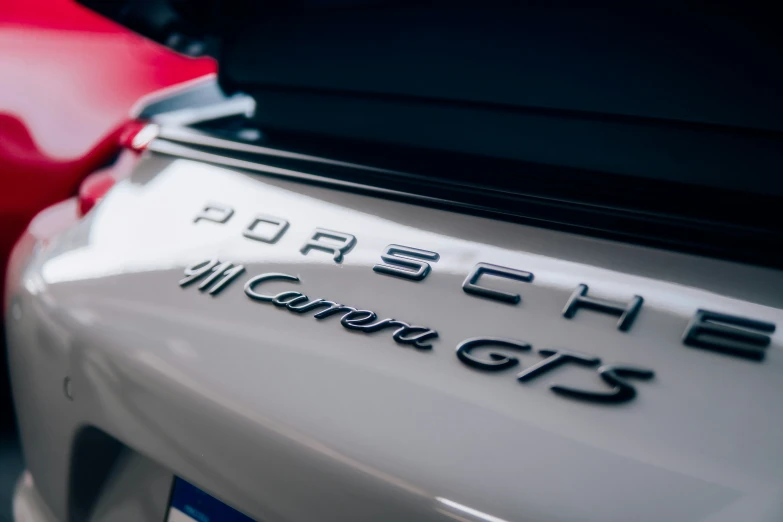 the badge of a porsche car that is on display