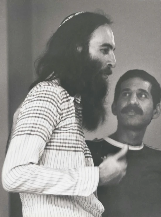 a young man getting ready for a performance with his friend