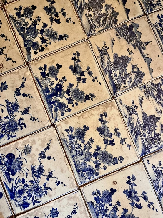 tiles with blue flowers and birds in them