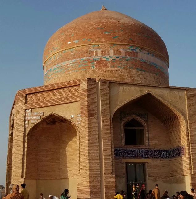 people are around a large, colorful building