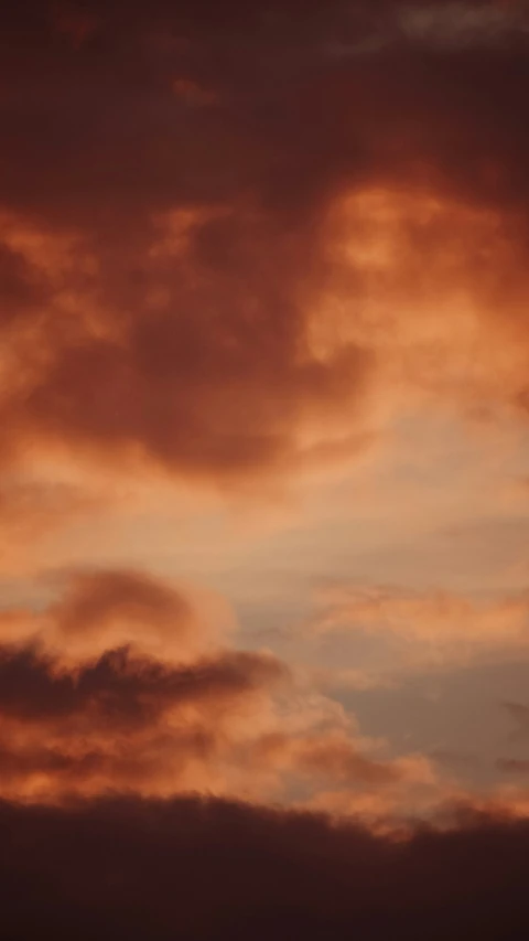 the red sky has orange and yellow clouds