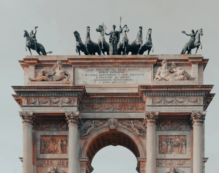 a clock that is on top of the arch