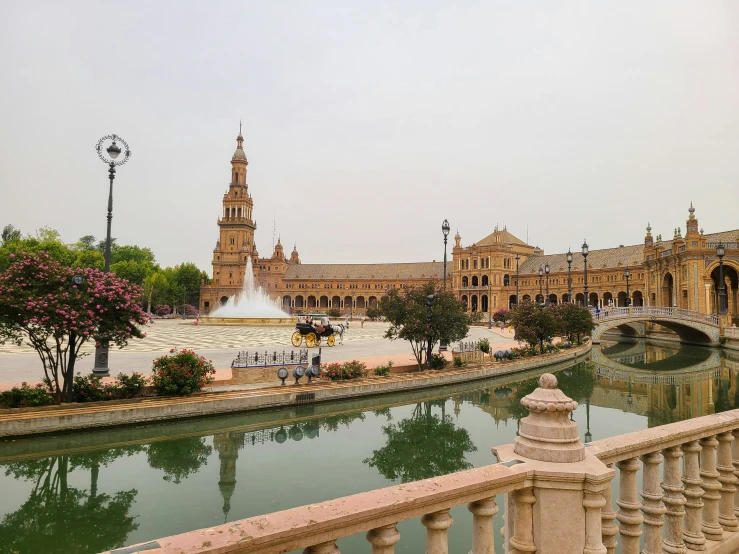 the view from a bridge looking at buildings and a park