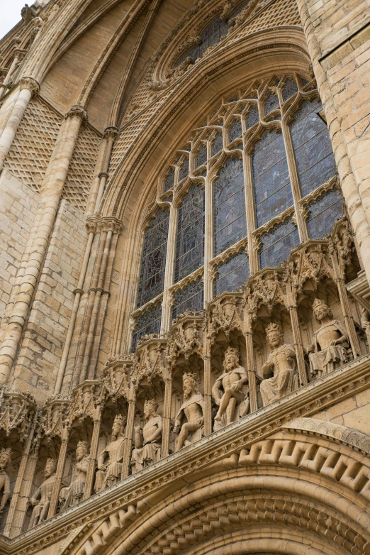 an ornate building with multiple windows and sculptures