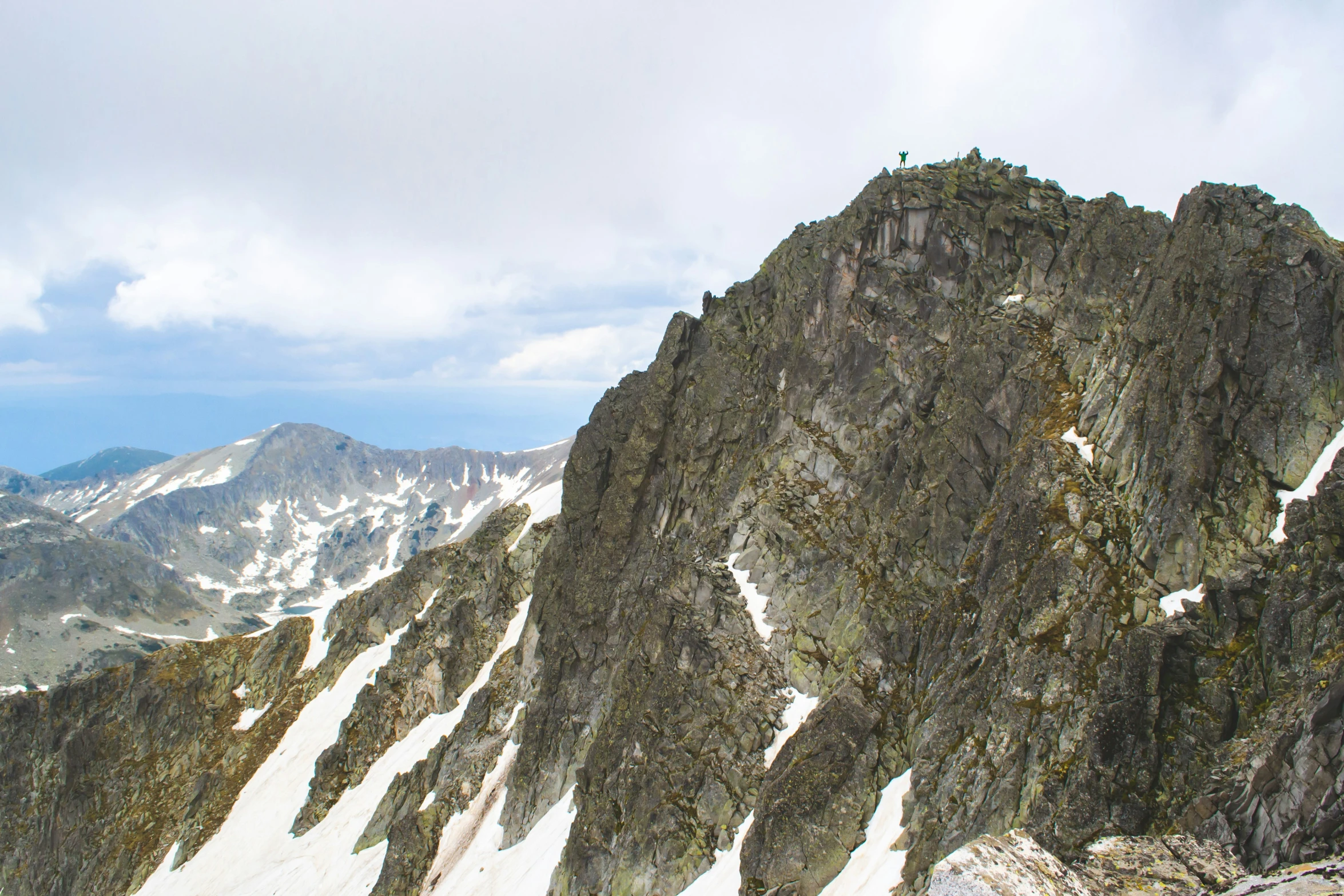 a group of mountains with snow on top