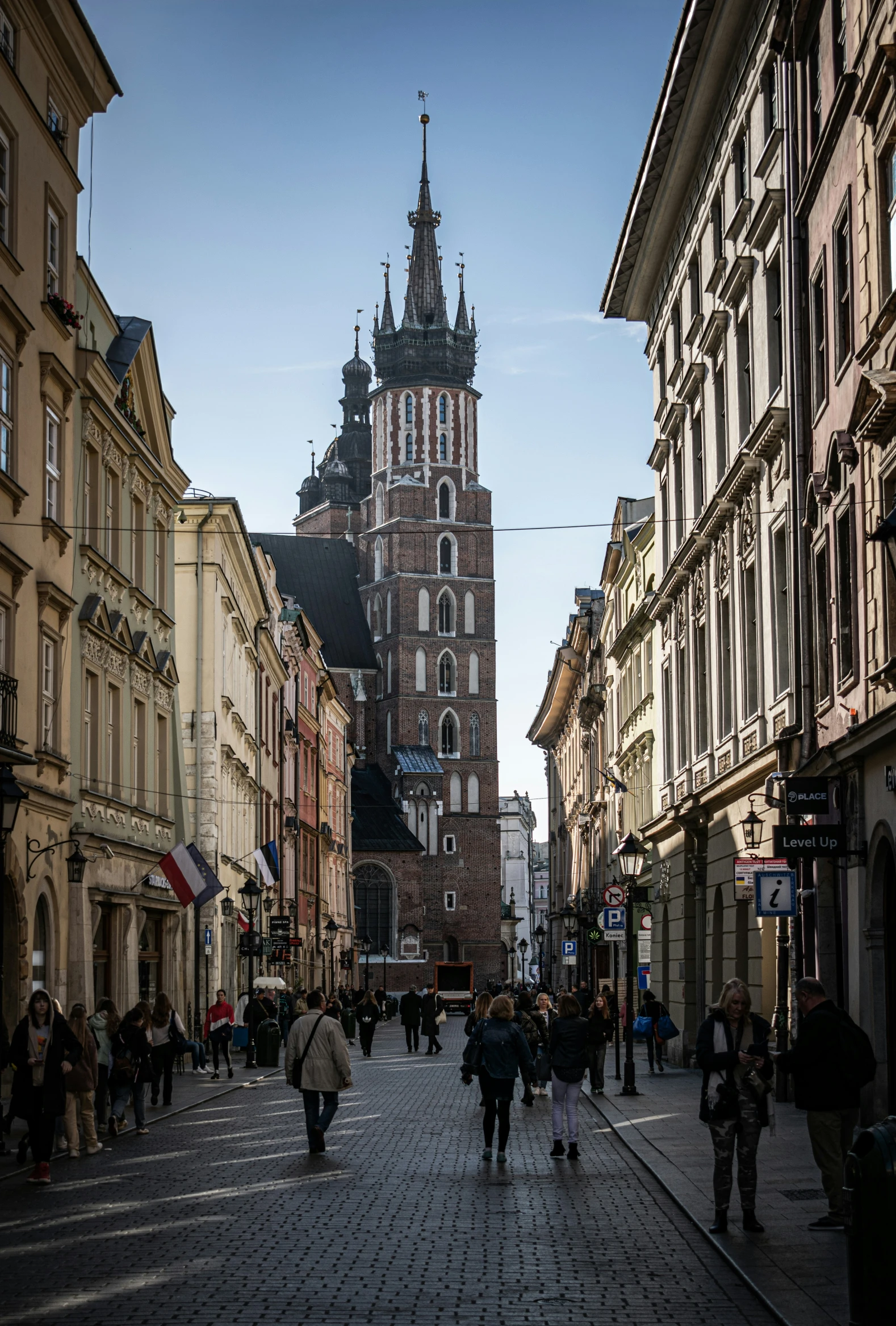 a busy street with people walking around it