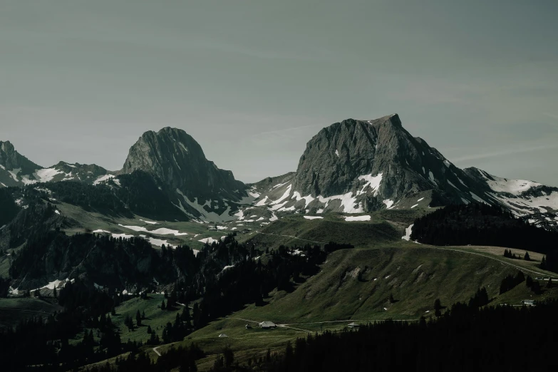 mountains under a clear sky covered in snow