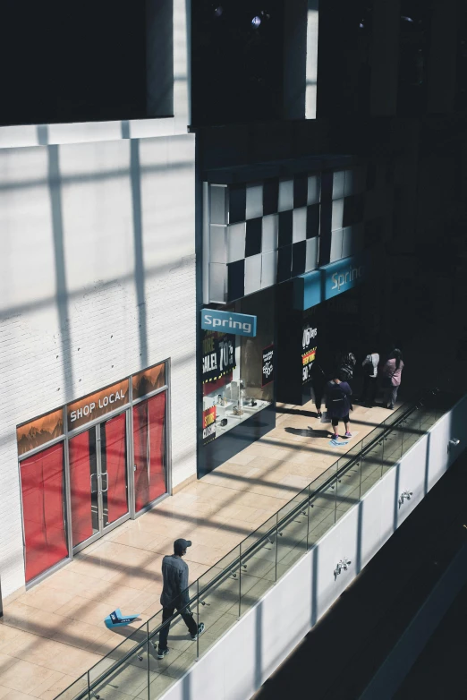 an artist's impression of a man walking in front of a movie theater