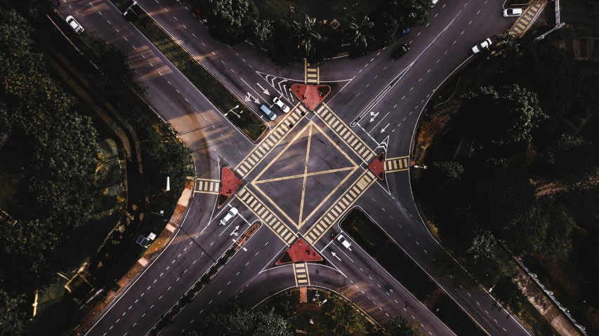 an aerial view of a city intersection with overhead traffic