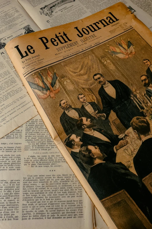 old papers spread out with paper showing images of people