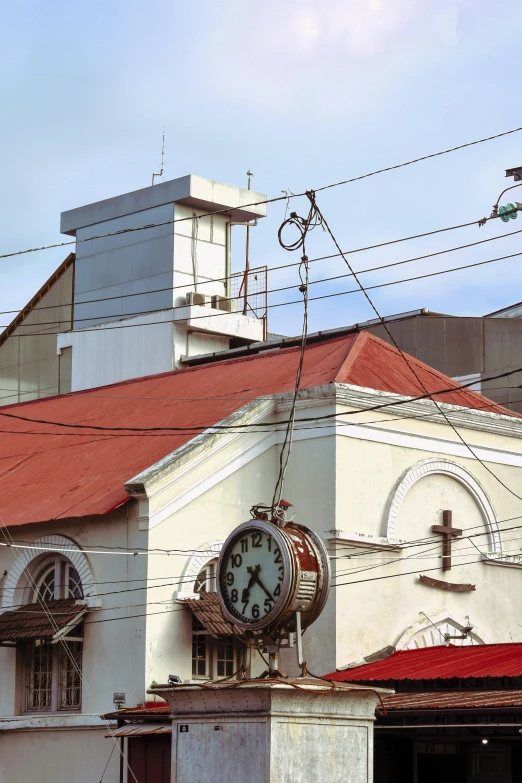 the large clock is on the side of the church building