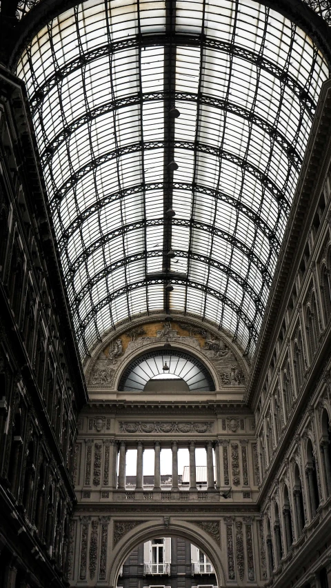 the interior of a train station with an arched ceiling