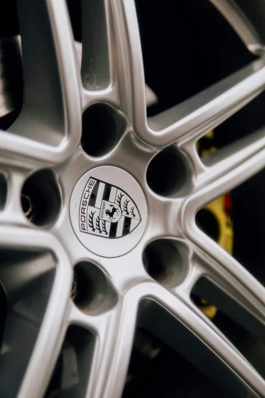 a white tire with a emblem with black letters